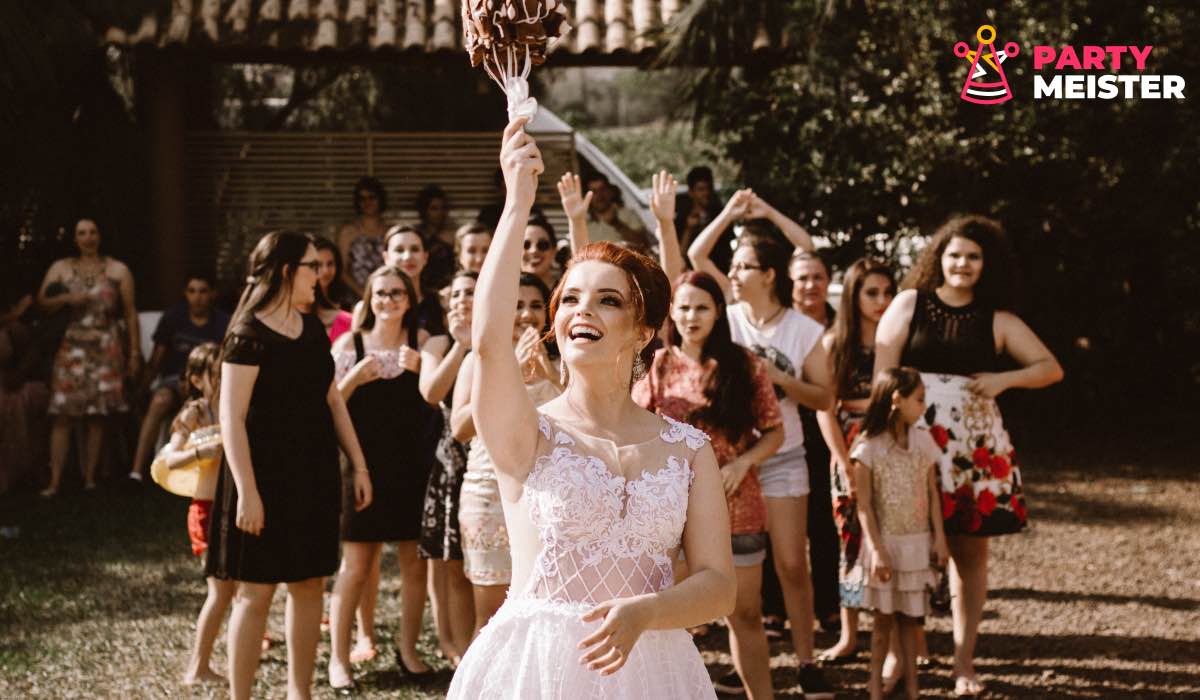 A bride performing a bouquet toss during a wedding