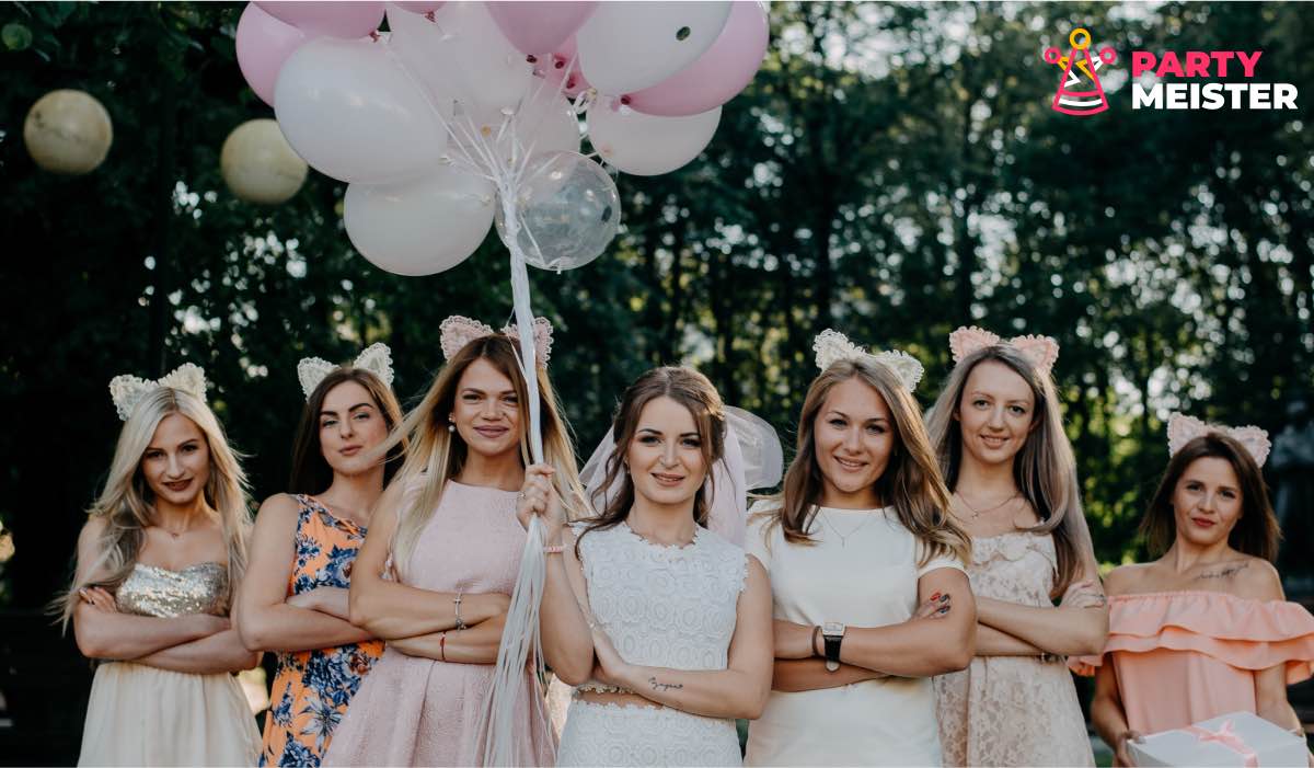 A group of bridesmaids pose for a photo at a wedding