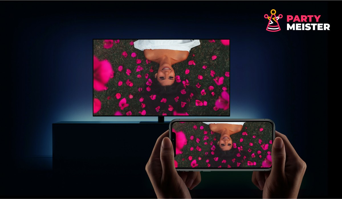 iPhone and Smart TV displaying the same image of a woman laying  in a field of flowers
