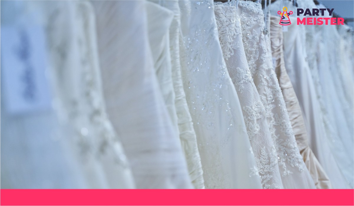 Several wedding dresses on hangers